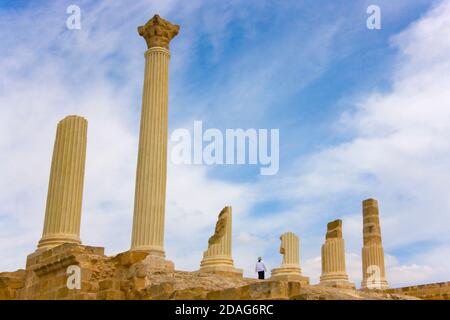 Tourist at Roman ruins at Uthina (also known as Oudna), Ben Arous Governorate, Tunisia Stock Photo