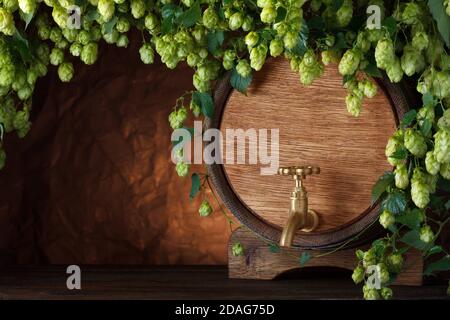 a cylindrical container bulging out in the middle, traditionally made of wooden staves with metal hoops around them. Stock Photo