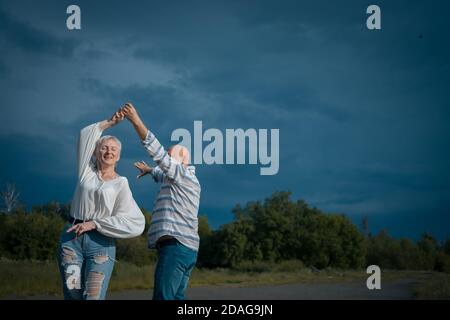 happy senior couple have romantic dating and dancing outdoor at summer Stock Photo