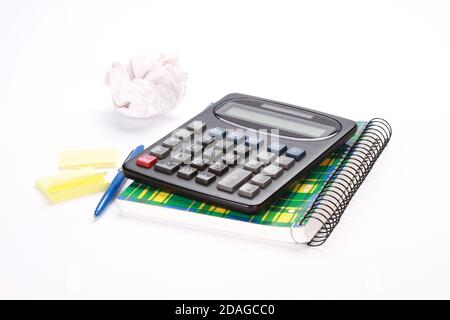 Calculator, notebook, pen, and stickers isolated on a white background Stock Photo