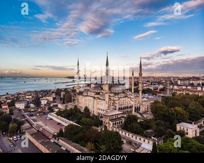 Blue mosque is under a renovation in Istanbul, Turkey. Aerial view of the sunrise with amazing clouds and Bosporus at the background. Stock Photo