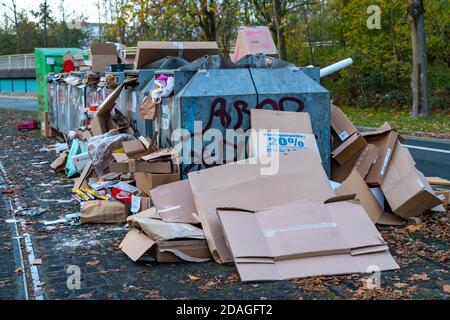 Overfilled waste paper containers, despite overcrowding, people put their waste paper next to them, Essen, NRW, Germany Stock Photo