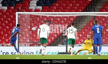 Republic of Ireland goalkeeper Darren Randolph (second right) dives in vain as England's Dominic Calvert-Lewin (left) scores his side's third goal of the game from the penalty spot during the international friendly at Wembley Stadium, London. Stock Photo