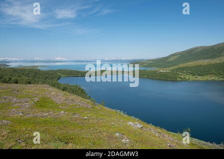 View towards lakeside village settlement of Staloluokta along Padjelantaleden Trail in Padjelanta national park, Lapland, Sweden Stock Photo