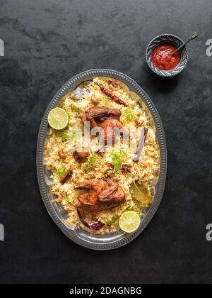 Arabic traditional food bowls Kabsa with meat. Top view. Stock Photo