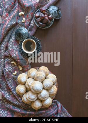 Eid and Ramadan Dates Sweets - Arabian cuisine. Egyptian cookies 'Kahk El Eid'. Top view. Stock Photo