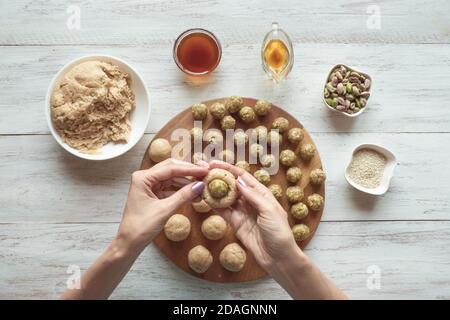Preparation of Egyptian cookies 'Kahk El Eid' - cookies of El Fitr Islamic Feast. Ramadan sweets. Stock Photo