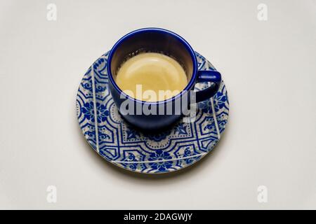 Espresso coffee in a blue espresso cup