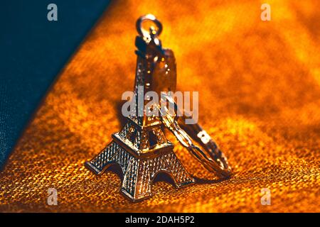 Souvenir from France . Miniature Eiffel Tower . Symbol of Paris Stock Photo