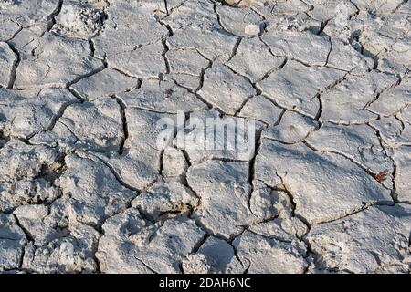 Detail of the grey, parched, austere, almost barren landscape near a hot pool at Fountain Paint Pot in yellowstone national park Stock Photo