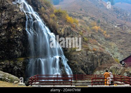 Kashmir, India. 12th Nov, 2020. Visitors explore the waterfalls on an autumn day in Drang about 40kms from Srinagar, the summer capital of Jammu and Kashmir. Credit: SOPA Images Limited/Alamy Live News Stock Photo