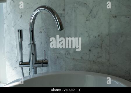 Modern bathroom column faucet in luxury bathroom. Stock Photo