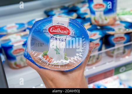 Tyumen, Russia-November 07, 2020: pack of Italian galbani buratta in the buyer hand Stock Photo
