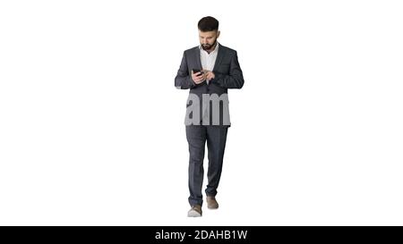 Businessman walking and using the phone on white background. Stock Photo