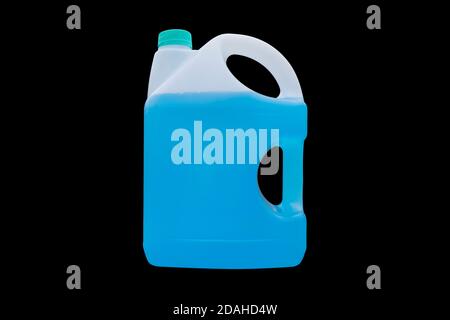 Winter window blue cleaner isolated on a black background with clipping path. Plastic canister with liquid for car on black background Stock Photo