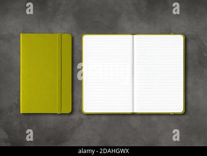 Olive green closed and open lined notebooks mockup isolated on dark concrete background Stock Photo