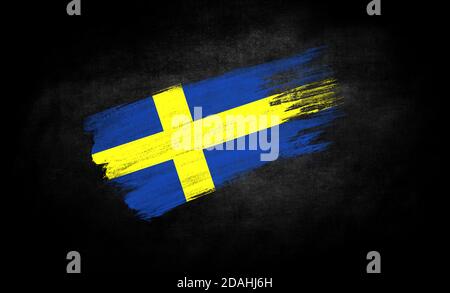 smear of paint in the form of the flag of Sweden close-up on a black background Stock Photo