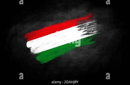 smear of paint in the form of the flag of Hungary close-up on a black background Stock Photo