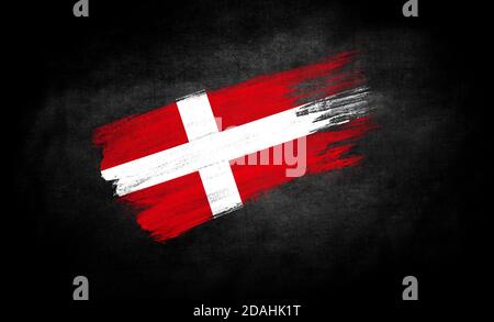 smear of paint in the form of the flag of Denmark close-up on a black background Stock Photo