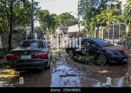 Manila, Philippines. 13th Nov, 2020. Damaged cars are seen after the flood brought by Typhoon Vamco in Manila, the Philippines, Nov. 13, 2020. The Philippine government said on Friday that Typhoon Vamco, which has caused devastating floods and landslides in the main island of Luzon, has killed at least 14 people, officials said. Credit: Rouelle Umali/Xinhua/Alamy Live News Stock Photo