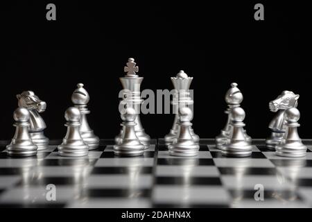 Chess pieces are lined up and ready to play Stock Photo