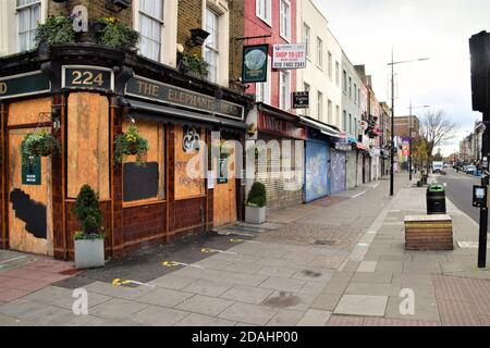 London, UK. 12th November 2020. A closed and boarded up Elephant's Head Pub and deserted Camden High Street during the second national covid lockdown in England. Credit: Vuk Valcic/Alamy Stock Photo