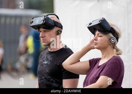 Adult man and woman with VR glasses Stock Photo