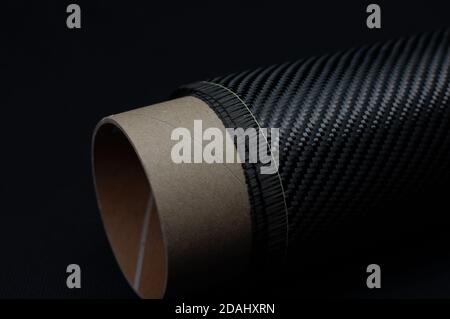 Carbon fiber with twill weave on carton roll Stock Photo