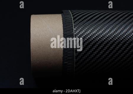 Carbon fiber with twill weave on carton roll Stock Photo
