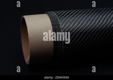 Carbon fiber with twill weave on carton roll Stock Photo