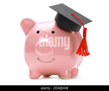 Piggy bank and black graduate hat isolated on white background. Stock Photo