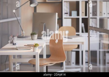 Image of modern office interior with desk and computer at empty office Stock Photo