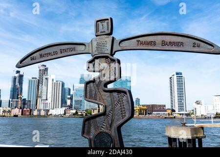 Signpost with the mileage to Waterloo Station and Thames Barrier. One of 1000 mileposts funded by the Royal Bank of Scotland sponsored cycle network. Stock Photo