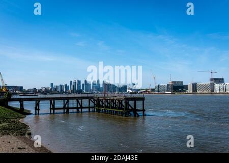 View back from the Thames Barrier towards the financial district of Canary Wharf. Stock Photo