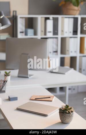 Image of office table with computer monitor and other office supplies on it at office Stock Photo
