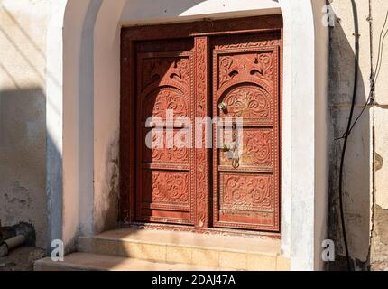 Old Arabian entrance door with Ornaments of old house in Oman. Stock Photo