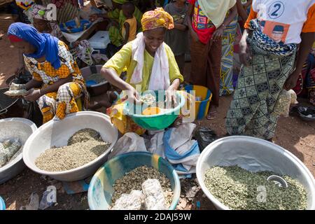 Selingue, Mali, 25th April 2015; Dried okra seller, Adiara Sidibe, 35. She grows and dries her own okra.  She can make up to 10,000 CFA per market day. Stock Photo
