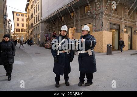 Two female police officers in a special uniform keep order on the city street. Stock Photo