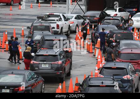 Miami Gardens, FL, USA. 12th Nov, 2020. Cars wait in line at the Coronavirus (COVID-19) drive in testing site, set up in the parking lot of Hard Rock Stadium as Florida reported more than 5,838 new cases of COVID-19 on November 12, 2020 in Miami Gardens, Florida. Credit: Mpi04/Media Punch/Alamy Live News Stock Photo