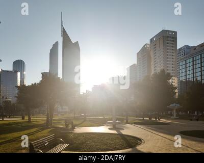 Famous Abu Dhabi city park at downtown - beautiful modern park scene at sunset surrounded by skyscrapers - stress free view Stock Photo