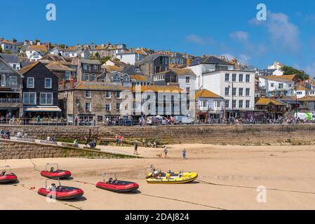 Boats on St Ives harbour beach at low tide, St Ives, Cornwall, UK Stock Photo