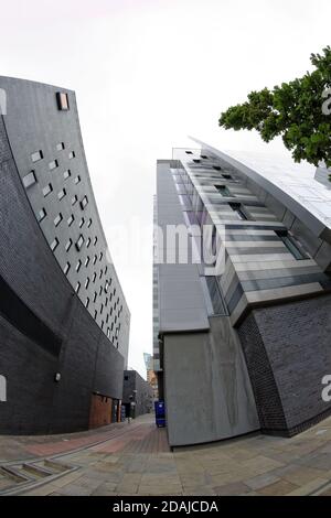 Alleyway between the modern Crowne Plaza and Holiday Inn Express Manchester  City Centre Arena hotels Stock Photo - Alamy