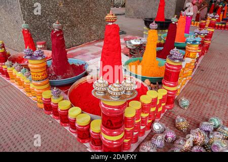 Ujjain, Madhya Pradesh / India - September 16th 2020: Kanku and hali (turmeric) pyramid to attract customer in street shops outside Indian temples for Stock Photo