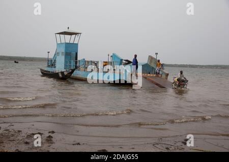 Selingue area, Mali, 27th April 2015; Ferry boat across the lake can carry motobikes, a couple of cars or a truck and charges 20,000 CFA for a car for a round trip. Stock Photo