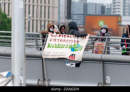 Glasgow, Scotland, UK. 13th November, 2020. Environmental campaigners protest on the banks of the River Clyde. Credit: Skully/Alamy Live News Stock Photo