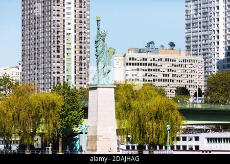 PARIS, FRANCE - Apr 22, 2015: Statue of Liberty on the swan island in Paris. It was inaugurated on November 15, 1889 as a remembrance to commemorate t Stock Photo