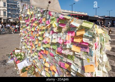 View looking north west with post-it notes as tributes stuck to the base of the needle as tributes to the terror attack victims of June 2017. Southwar Stock Photo