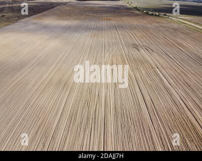 Plowed agricultural field, aerial view. Agricultural land. Stock Photo