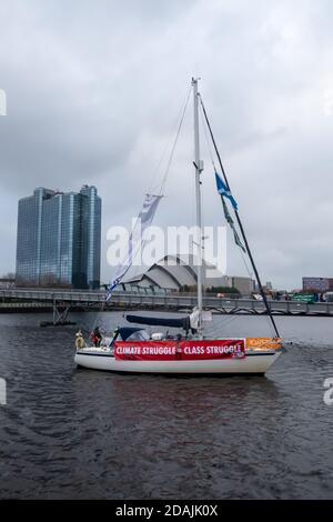 Glasgow, Scotland, UK. 13th November, 2020. Environmental campaigners protest on the banks of the River Clyde. Credit: Skully/Alamy Live News Stock Photo