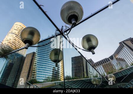 PARIS, FRANCE - Nov 07, 2017: Modern architecture and buildings in Paris business district. Skyscrapers with glass facade. Light and reflections Stock Photo